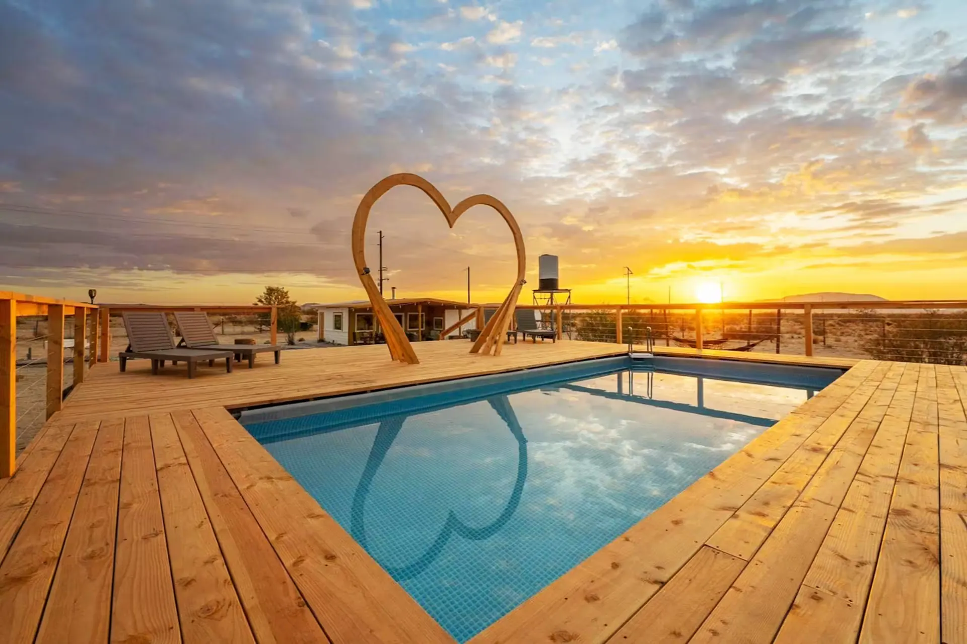 Heart pool and sculpture at sunset